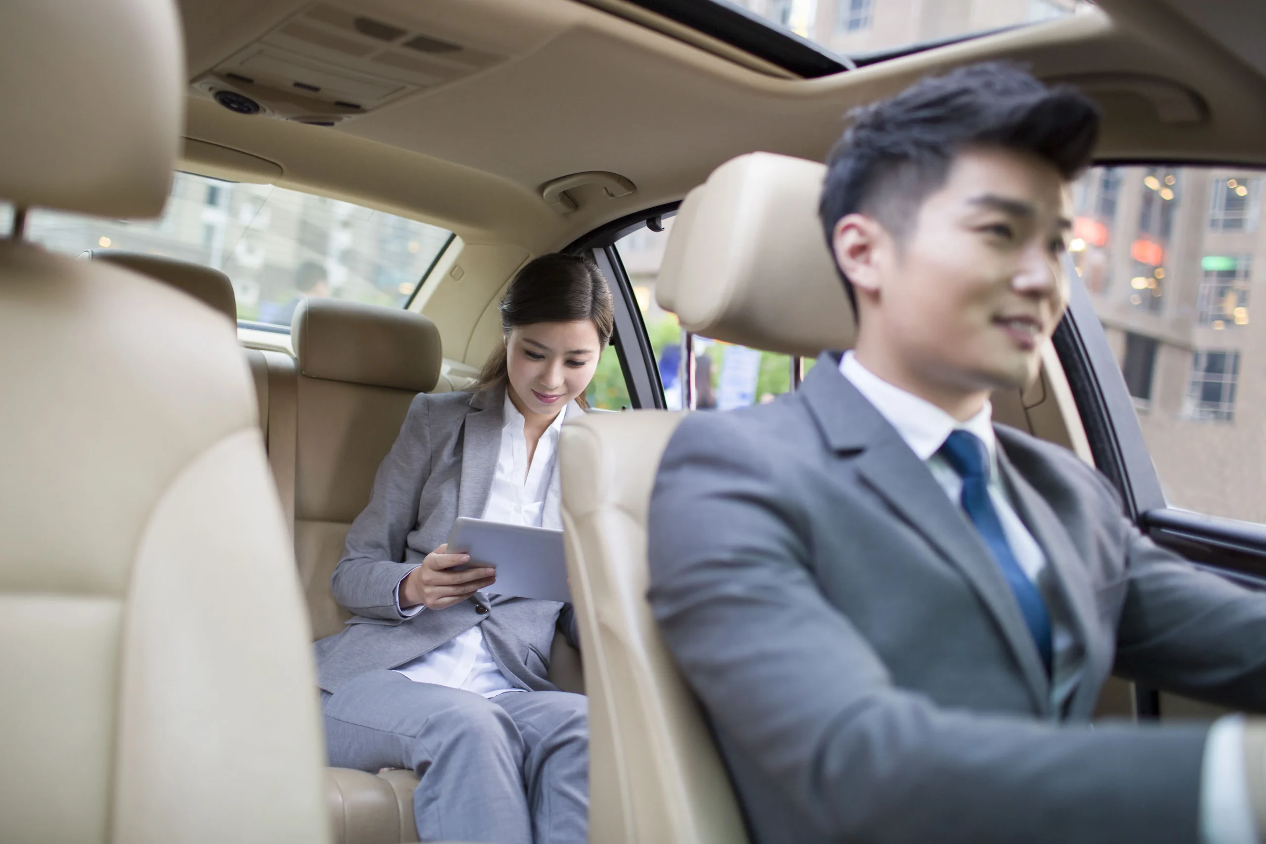 chauffeur-driving-car-for-a-businesswoman-2024-10-18-06-29-29-utc-min